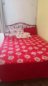 Giường trong phòng chung tại Residencial 9 Irmãos