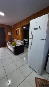 Ένα ή περισσότερα κρεβάτια σε δωμάτιο στο Lindo Residencial na Praia Itapeva Torres