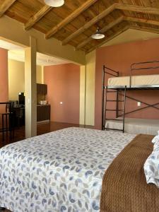 Giường trong phòng chung tại Tikaaaj House Ideal para 3 o 4 personas