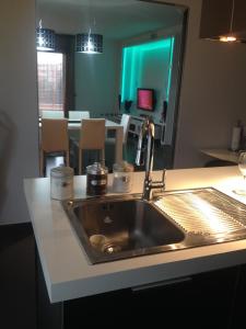 a kitchen with a sink and a counter top at Alex House in Cagliari
