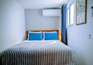 Postel nebo postele na pokoji v ubytování Downtown Guesthouse