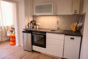 Kuchyň nebo kuchyňský kout v ubytování Arden Stay Apartments + 21 fotografií