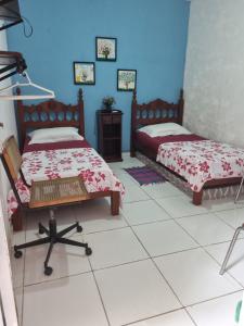 Voodi või voodid majutusasutuse Pousada da Didi toas