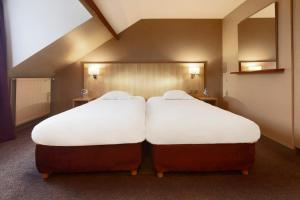 Postel nebo postele na pokoji v ubytování Hôtel Europe and Spa + 27 fotografií
