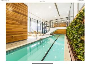 an indoor swimming pool in a house at Central City Prime-next to SKY in Auckland