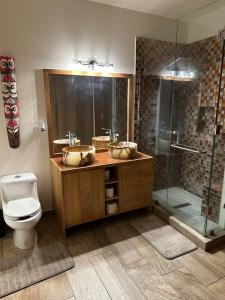 a bathroom with two sinks and a shower at Hello Sunshine! in Cabo San Lucas