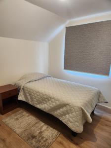 Postel nebo postele na pokoji v ubytování Casa San José de la Mariquina Urban Sector