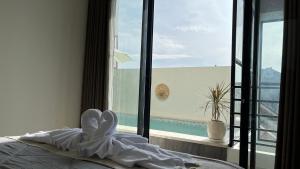 Ένα ή περισσότερα κρεβάτια σε δωμάτιο στο Puspa Nirwana Villa