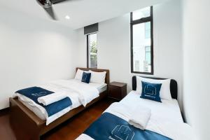 Ένα ή περισσότερα κρεβάτια σε δωμάτιο στο Luxury Villa Putrajaya 16 - Smarthome +66 φωτογραφίες