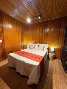 Ένα ή περισσότερα κρεβάτια σε δωμάτιο στο Recanto Bellagio