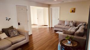 a living room with two couches and a table at McAfee Room 2 in Decatur