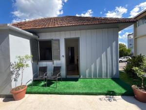 a small house with a green lawn at Garibaldi Guest House in Garibaldi