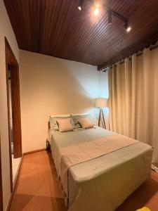 Ένα ή περισσότερα κρεβάτια σε δωμάτιο στο Recanto Bellagio