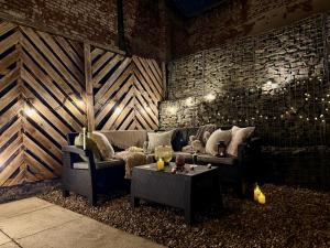 a living room with a couch and a table at The Viva Apartments Luxe in Birmingham