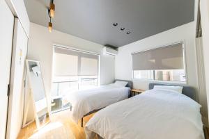 Ένα ή περισσότερα κρεβάτια σε δωμάτιο στο Kotohaku 南後背