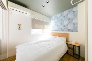 Voodi või voodid majutusasutuse 1棟貸し 最大7名 屋上ジャグジーで極上体験 和室と広々リビングで快適ロングステイ toas