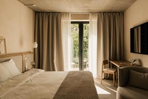 Ліжко або ліжка в номері At Hotel 35 +32 фото