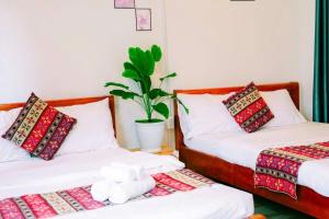 Ένα ή περισσότερα κρεβάτια σε δωμάτιο στο Lavender Homestay Măng Đen