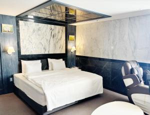 Ένα ή περισσότερα κρεβάτια σε δωμάτιο στο Dongdaemun Signature Tourist Hotel