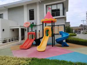 a playground with three slides at KozySpace in Davao City