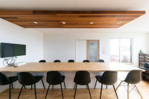 a conference room with a large table and chairs at Kotohaku 木津町 in Kizugawa