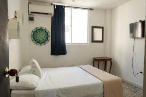 Postel nebo postele na pokoji v ubytování MANGO BiCHE - HOUSE