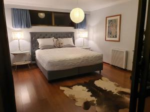 Giường trong phòng chung tại Waipaipai Stay