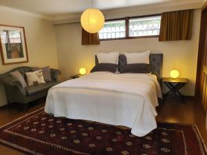 Giường trong phòng chung tại Waipaipai Stay