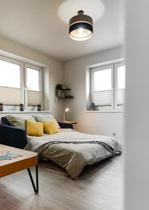 En eller flere senge i et værelse på LuxCity Apartment