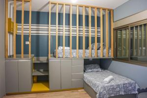 Ένα ή περισσότερα κρεβάτια σε δωμάτιο στο SeaRenity, Your Urban Retreat