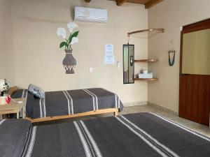 Ένα ή περισσότερα κρεβάτια σε δωμάτιο στο Casa Aldairis