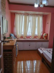 Ένα ή περισσότερα κρεβάτια σε δωμάτιο στο Albergo Cozy condo