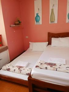 Ένα ή περισσότερα κρεβάτια σε δωμάτιο στο Albergo Cozy condo