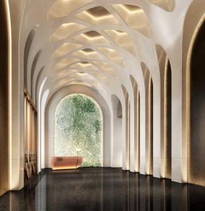 an empty hallway with a vaulted ceiling and a window at Vignette Collection TFT Chongqing by IHG in Chongqing