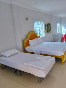 Postel nebo postele na pokoji v ubytování Lida Kampot Guesthouse