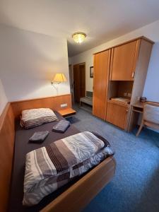 Ένα ή περισσότερα κρεβάτια σε δωμάτιο στο Gästehaus & Monteurzimmer Reichenbach an der Fils