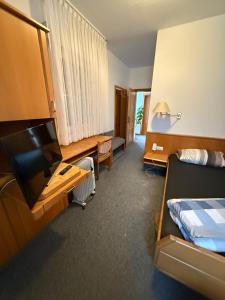 Ένα ή περισσότερα κρεβάτια σε δωμάτιο στο Gästehaus & Monteurzimmer Reichenbach an der Fils +6 φωτογραφίες