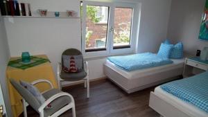 Postel nebo postele na pokoji v ubytování Wohnung 2 im Haus Wattenblick