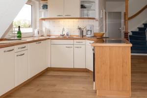 Kuchyň nebo kuchyňský kout v ubytování Whg Dünenblick im Haus Wattenblick