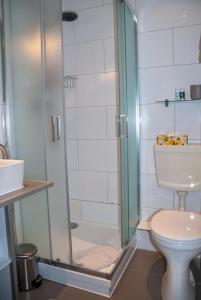 Et badeværelse på Wohnung 3 im Haus Wattenblick