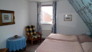 En eller flere senge i et værelse på Wohnung 4 im Haus Wattenblick