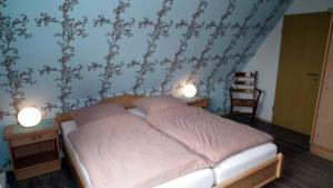 En eller flere senge i et værelse på Wohnung 4 im Haus Wattenblick