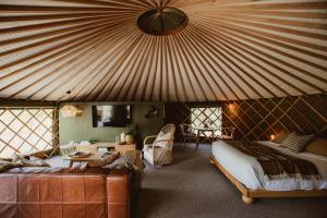 Ένα ή περισσότερα κρεβάτια σε δωμάτιο στο The Green Tent