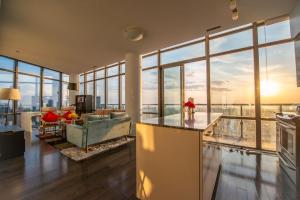 a living room with a view of the city at Urban Skyline in Toronto