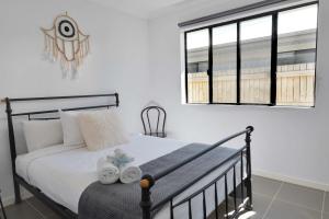 Ένα ή περισσότερα κρεβάτια σε δωμάτιο στο Whitsundays Paradise by the Port