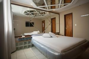 Ένα ή περισσότερα κρεβάτια σε δωμάτιο στο Motel Caricia (Adult Only) +33 φωτογραφίες