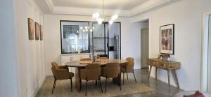 a dining room with a table and chairs at Alba Gardens in Gatunga