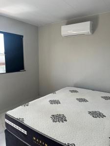 a bed in a room with a mattress sidx sidx sidx at Hostel dos amigos in Salinópolis