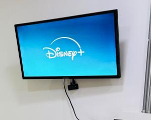 a computer monitor with a disney logo on the screen at Loft ejecutivo con Aire Acondicionado, cerca de Clinica Duarte y UFPS in Cúcuta +11 photos