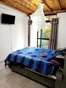 Una cama o camas en una habitación de Casa rústica